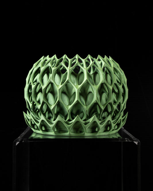 Planter-01: Sculptural indoor planter with integrated drainage and matching saucer.